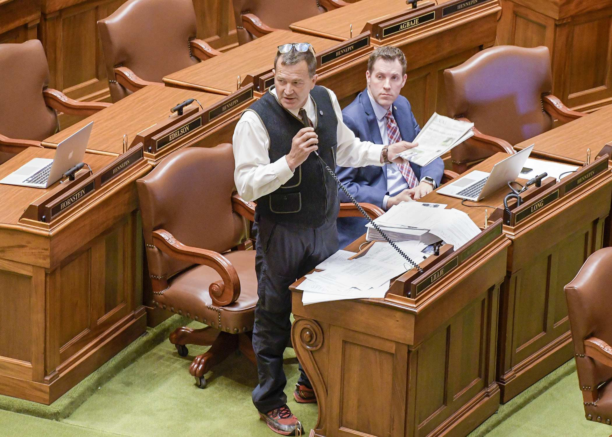 Rep. Leon Lillie, chair of the House Legacy Finance Committee, presents the omnibus Legacy bill on the House Floor during Saturday’s session. Photo by Andrew VonBank